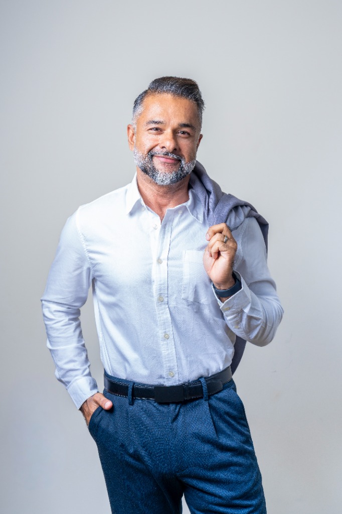 Commercial Corporate - Business casual jacket over shoulder